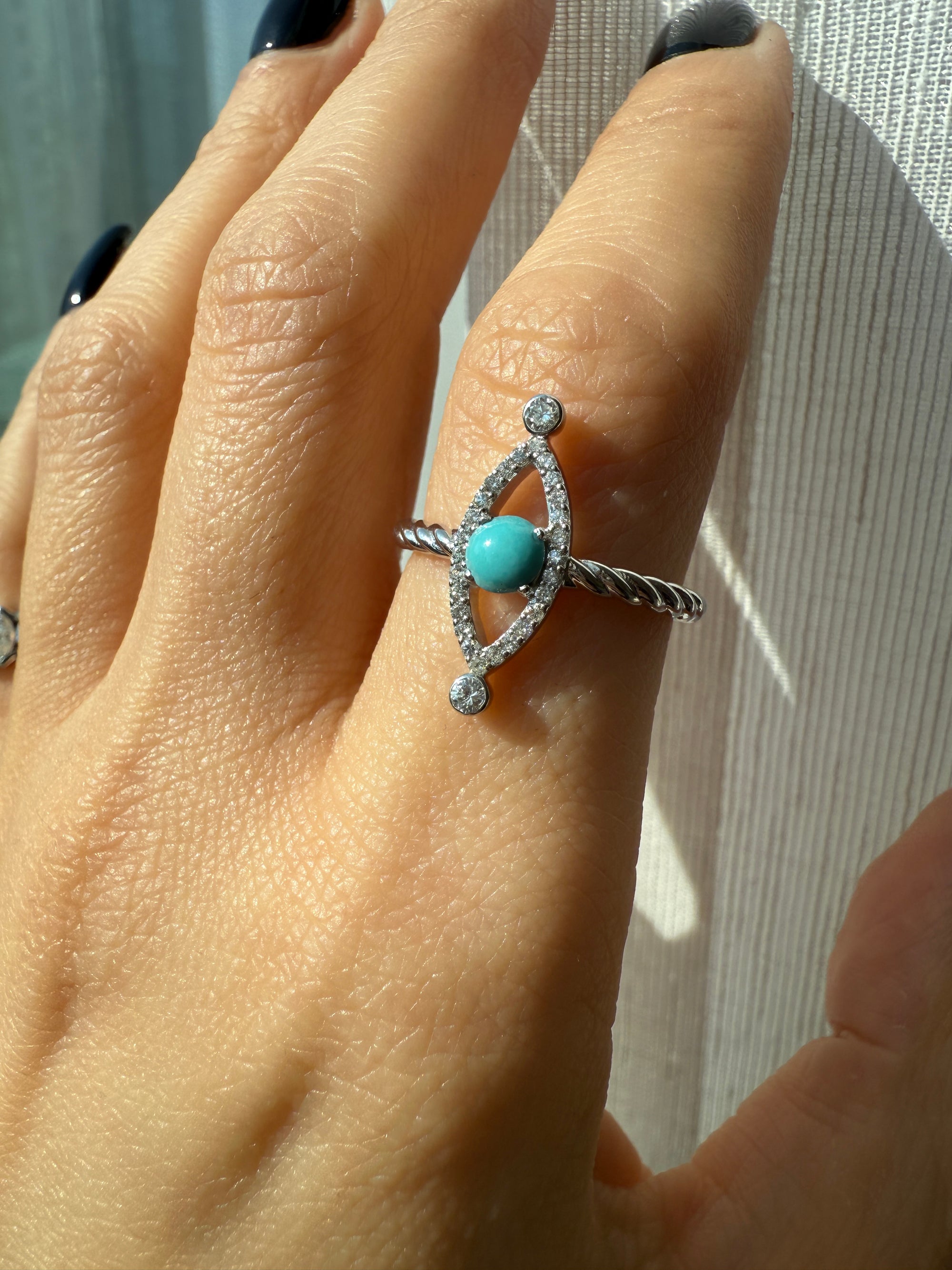 White gold ring with diamonds and turquoise