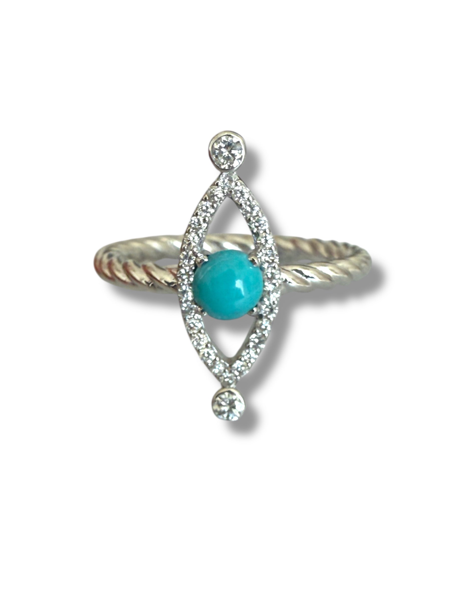 The Linea Eye - Evil Eye White Gold Ring by Nijma M Fine Jewelry features a twisted band, a central round turquoise stone in an oval frame with small clear gems and two larger stones at each end.