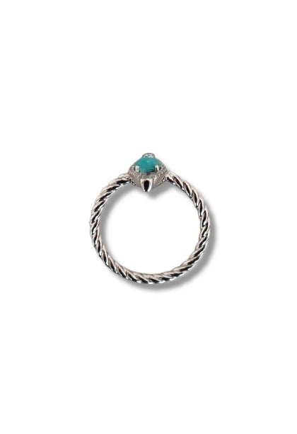The Linea Eye - Evil Eye White Gold Ring by Nijma M Fine Jewelry features a twisted band and a small turquoise center stone in a claw-like setting, shown against a white background.