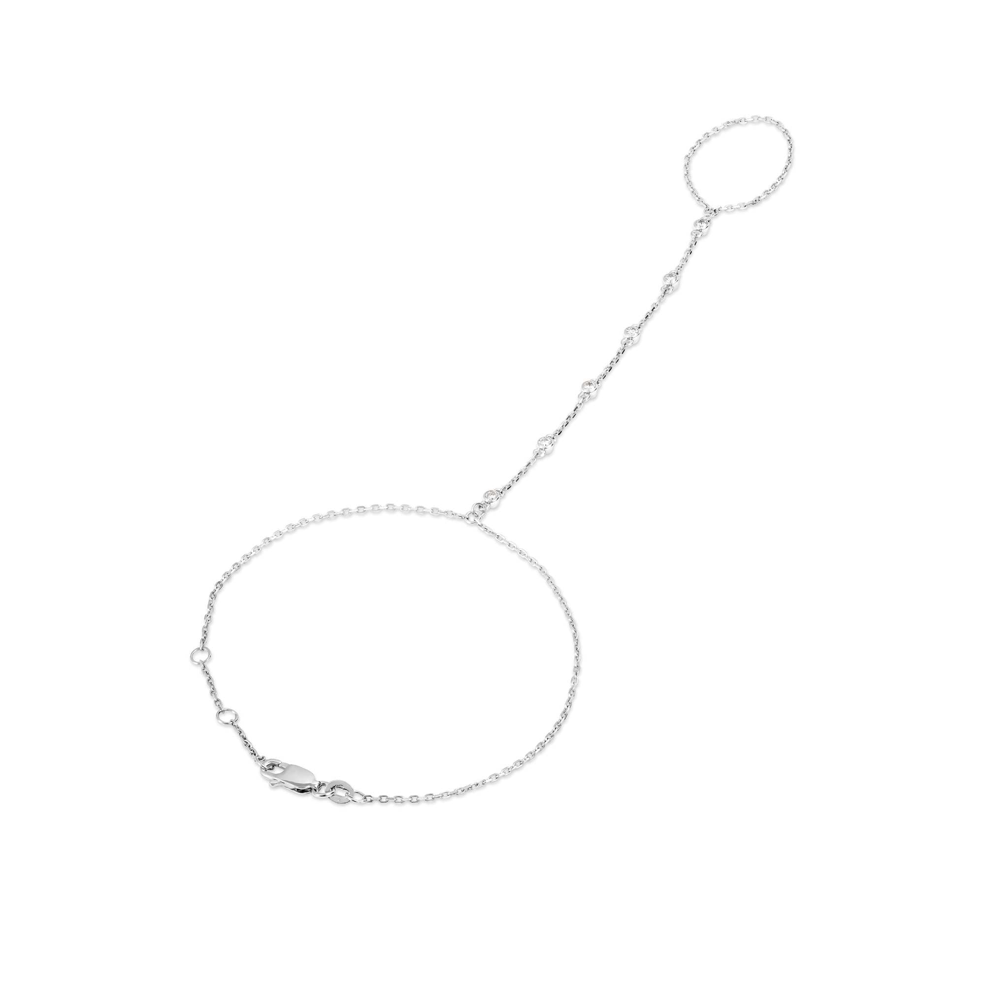 The Nijma M Fine Jewelry White Gold Diamond Hand Chain features 18K white gold, a slim bracelet linked to a matching finger ring by a delicate chain, with fine link detailing and a lobster clasp closure.